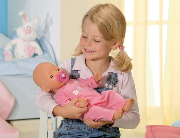 girls playing with baby dolls